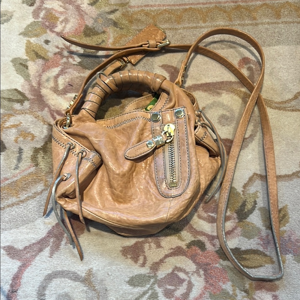 Tan Leather Shoulder Bag with Tassels and Metallic Accents